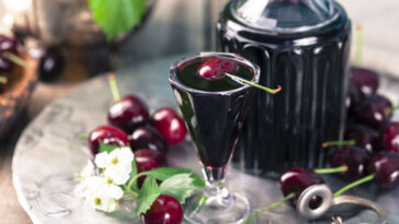 Cherry homemade liquor in a vintage bottle