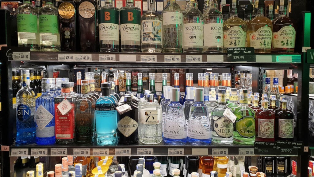 bottles of the most expensive gin on a shelf in a bar