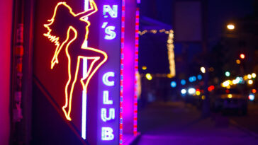 sign of strip clubs in NYC neon lights