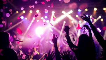 club lights with people's hands in the air
