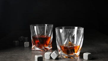 glasses of whiskey with whiskey stones