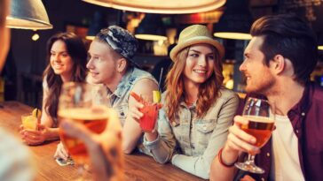 happy friends drinking at bars in Columbus Georgia