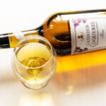11 Must-Try Calvados Cocktails 29 glass and bottle of calvados