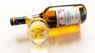 glass and bottle of calvados