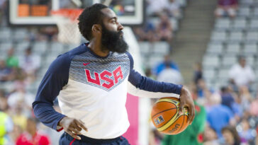 nba player james harden holding a basketball