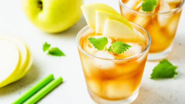 Kombucha cocktail, summer festive party drink, apple iced tea in glasses