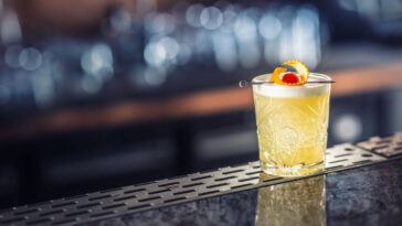 cocktail made with sour mix on a bar