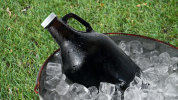 beer growler laying in a bucket of ice
