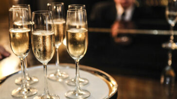 glasses of champagne on a serving tray