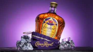 bottle of crown royal coming out of the bag with ice