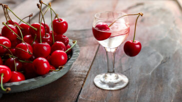 Kirsch or Kirschwasser alcoholic drink with cherry