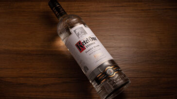 bottle of ketel one vodka on a wooden table