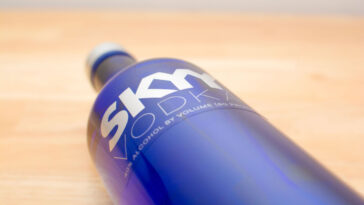 bottle of skyy vodka on a wooden table