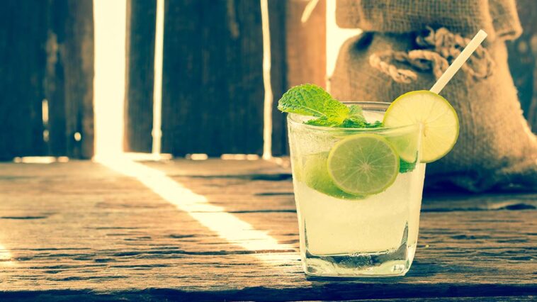 Top 15 1990's Cocktails to Drink 1 Mojito 1990s cocktail with fresh lime on wood table