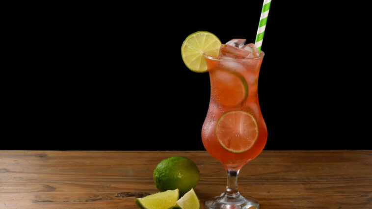 tropical hawaiian punch cocktail with limes