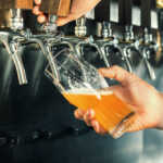 Bartender-pours-a-Draft-beer-or-Draught-Beer-at-the-bar