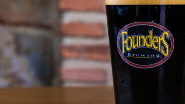 Close-up of a glass with Founders craft beer.