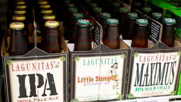 A view of several 6-pack cases of Lagunitas bottled beer, on display at a local liquor store.