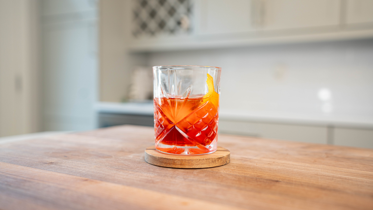 orange negroni cocktail on countertop