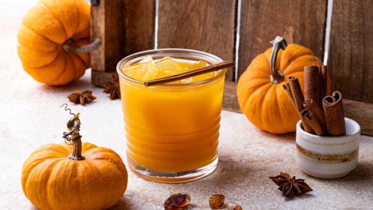 Fall pumpkin spice Old Fashioned cocktail with cinnamon or spiced bourbon smash
